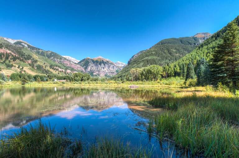 Beaver Pond view of mountain reflecting in water Beaver Pond view of mountain reflecting in water
