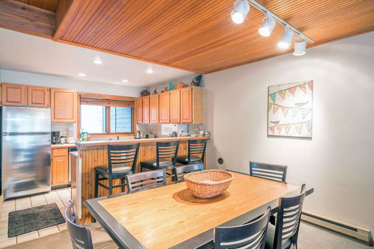 Dining room and kitchen with wood accents Dining room and kitchen with wood accents