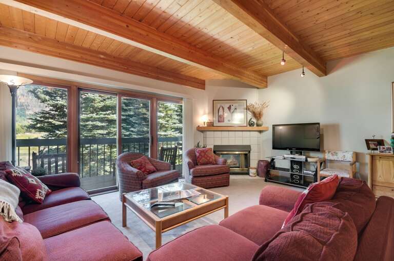 Living area to fireplace with comfortable sofa and chairs Living area to fireplace with comfortable sofa and chairs