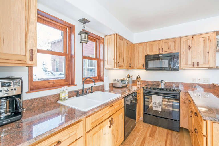 Kitchen with Microwave, Dishwasher, and Coffee Maker