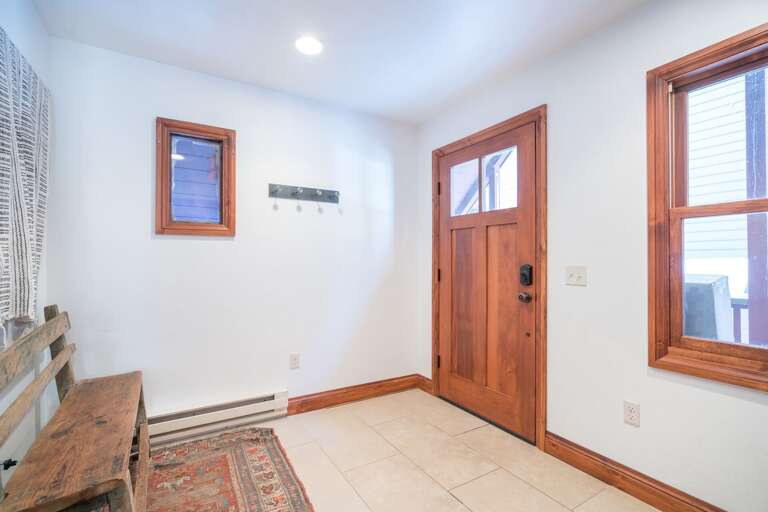 Spacious Foyer with a Bench