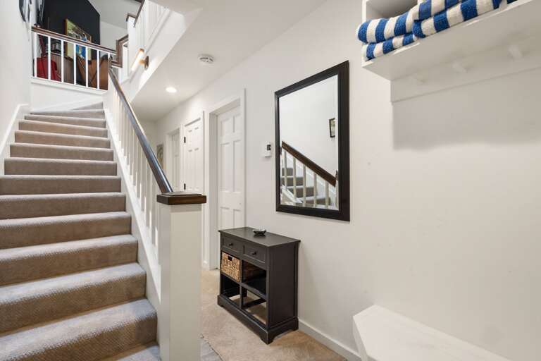 Lovely entryway with a comfy bench to take off ski boots after a long day on the slopes. The two bedrooms are located on this level. Lovely entryway with a comfy bench to take off ski boots after a long day on the slopes. The two bedrooms are located on this level.