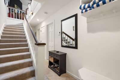 Lovely entryway with a comfy bench to take off ski boots after a long day on the slopes. The two bedrooms are located on this level. Lovely entryway with a comfy bench to take off ski boots after a long day on the slopes. The two bedrooms are located on this level.