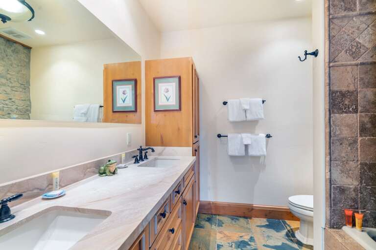 Large guest bathroom shared by queen room and bunk room