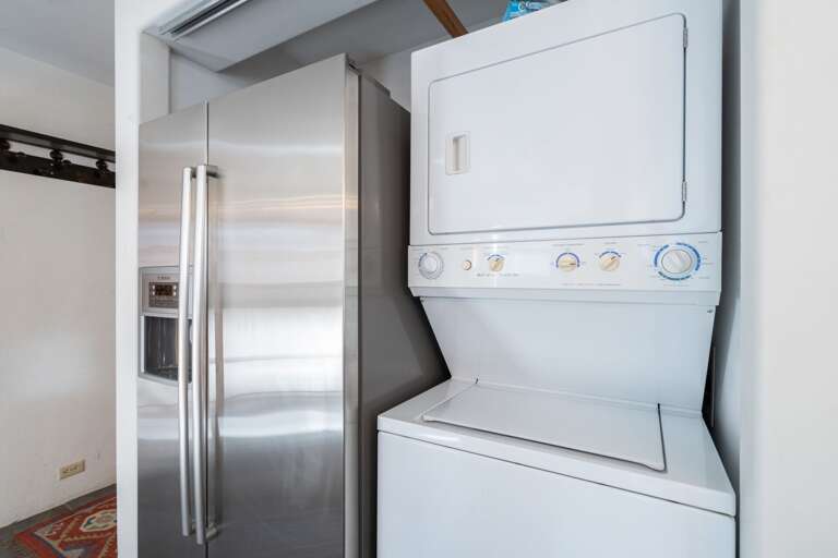 Refrigerator and Laundry Center in the Kitchen