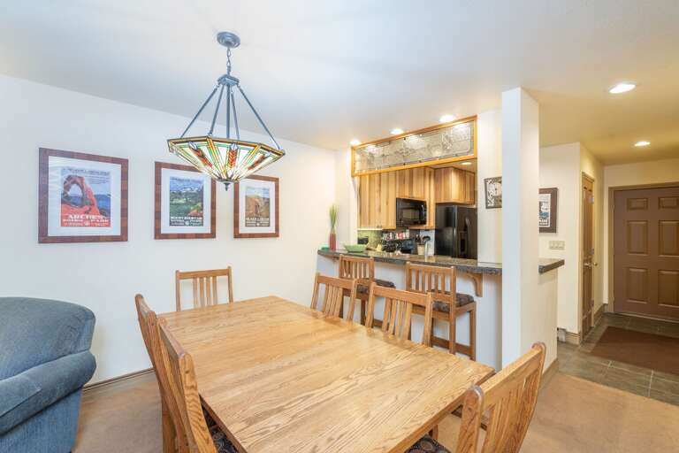 Vacation Rental Interior Featuring Spacious Dining Area Flowing Into Kitchen