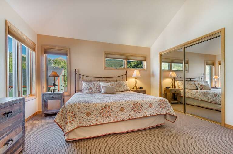 Master Bedroom with King Bed and Mirrored Closet