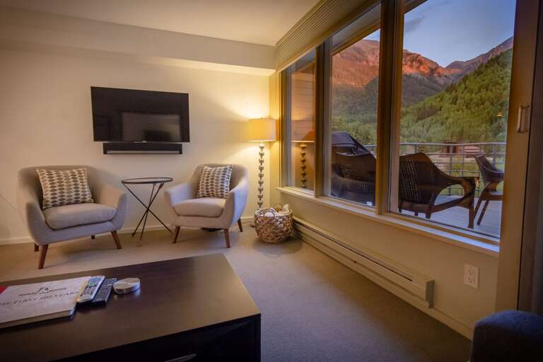 Living room with window to deck. Living room with window to deck.