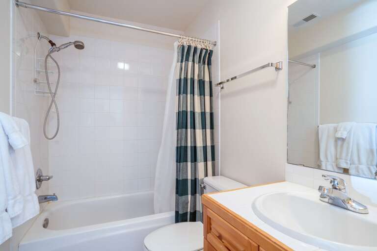 Full Bathroom with Shower/Tub Combo and Vanity