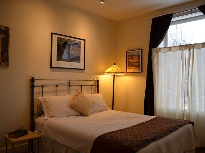 Third bedroom with a double bed and a lamp Third bedroom with a double bed and a lamp