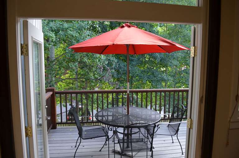 Deck with a table and seating for 3 Deck with a table and seating for 3