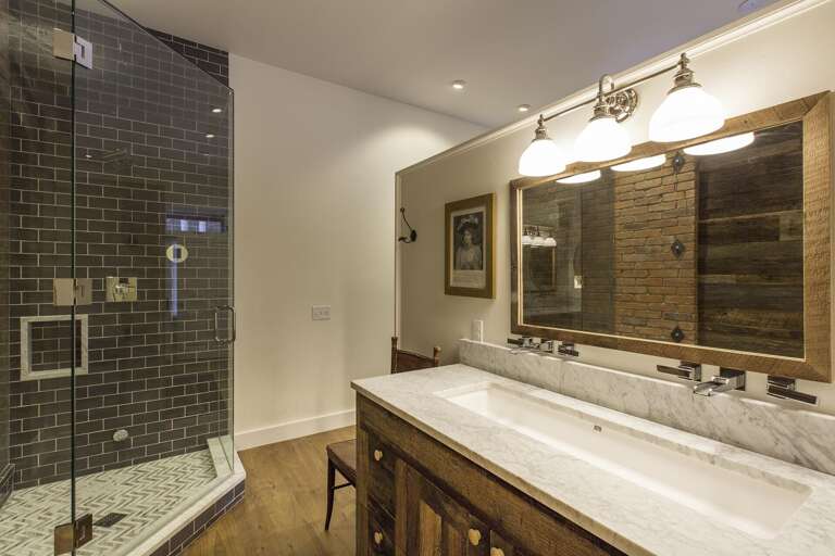 A sink and a walk in shower A sink and a walk in shower