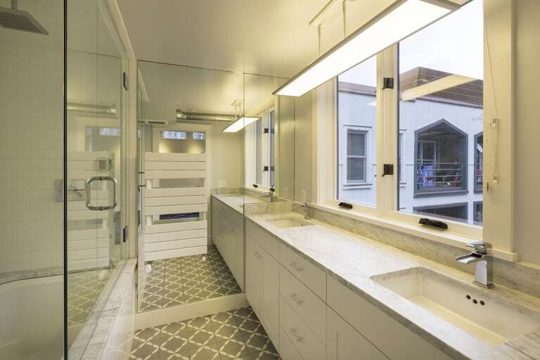 a spacious bathroom with sinks a spacious bathroom with sinks