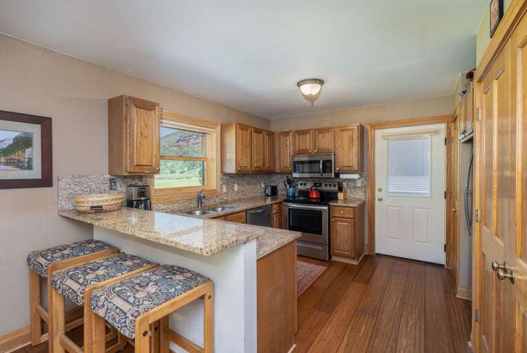 Bright Breakfast Bar In A Spacious Kitchen Within A Vacation Rental