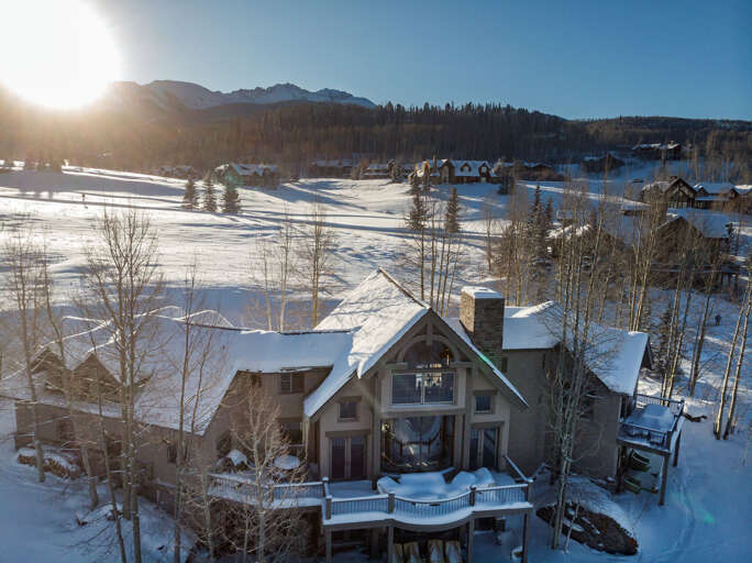 An external view of this Telluride golf rental, covered in snow. An external view of this Telluride golf rental, covered in snow.