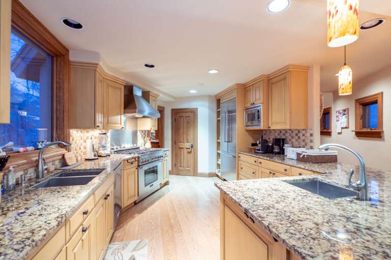 The kitchen of this Telluride golf rental, with two sinks and stainless steel appliances. The kitchen of this Telluride golf rental, with two sinks and stainless steel appliances.