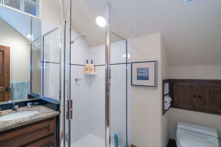 Walk-in shower with glass doors. Walk-in shower with glass doors.