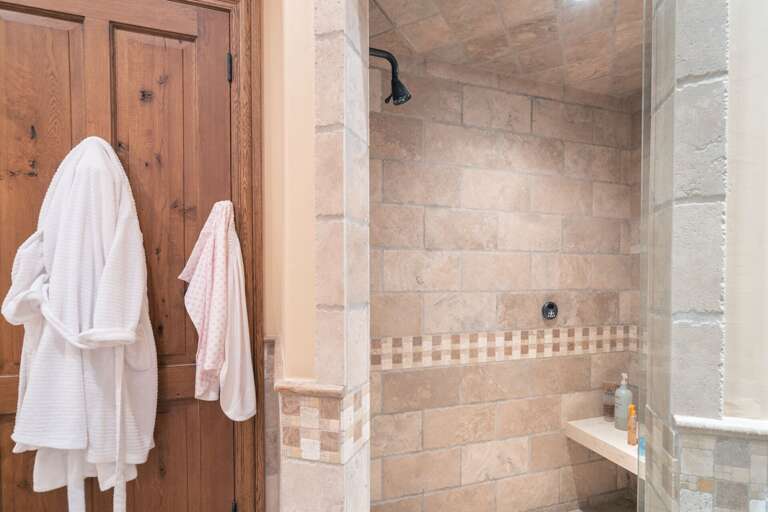 Walk-in shower with tile walls. Walk-in shower with tile walls.