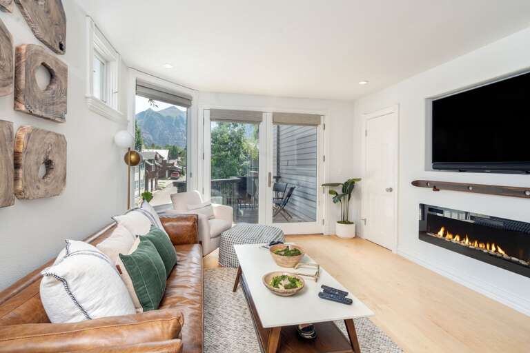 Living room with couch and flat screen tv.