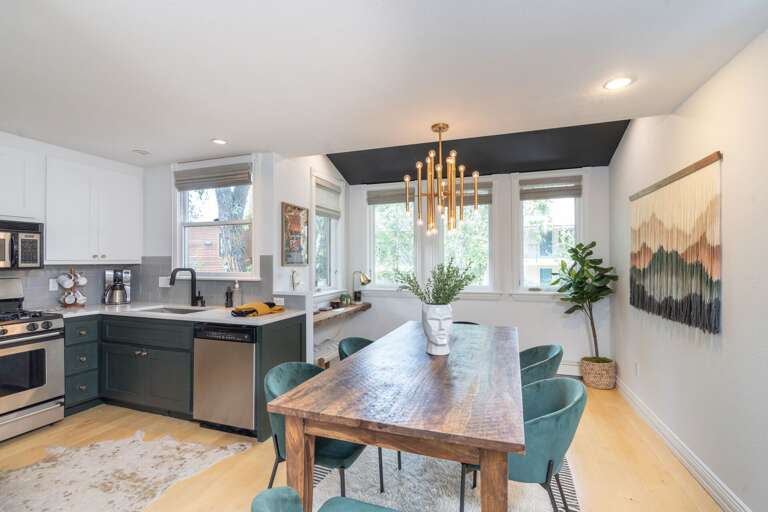 View of kitchen over dining room table.
