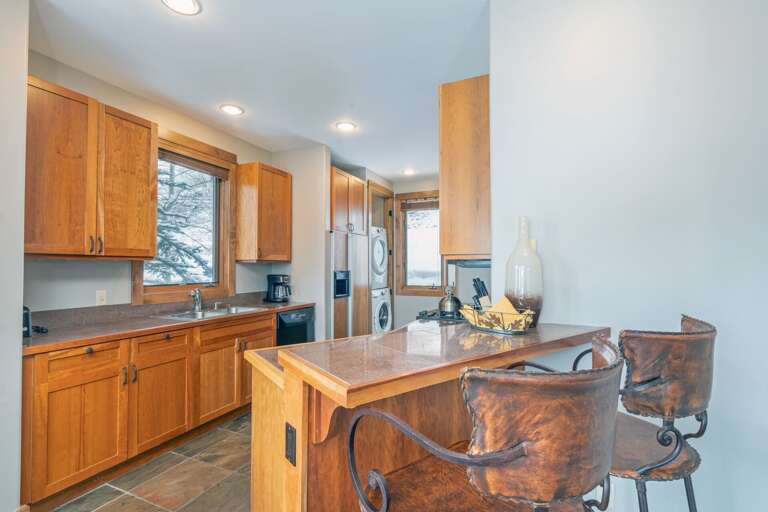 Kitchen with two bar stools at peninsula