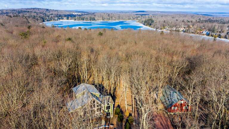 Aerial photo of this home, with neighboring house visible to the right.