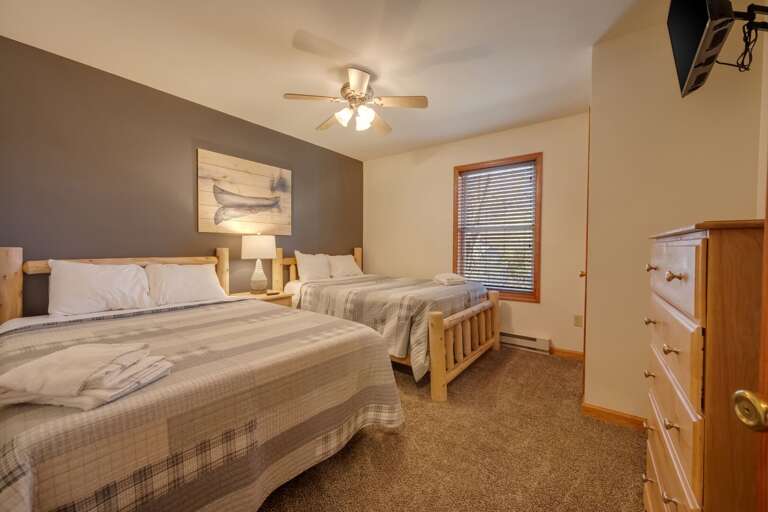 2nd Floor Bedroom 3 with 2 Full Beds, TV & Storage.