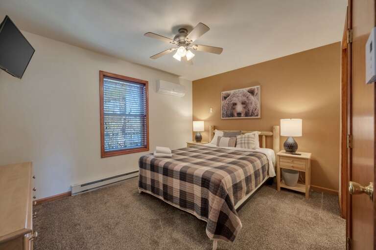 3rd Floor Bedroom 5 with 1 Queen Bed, TV & Storage.