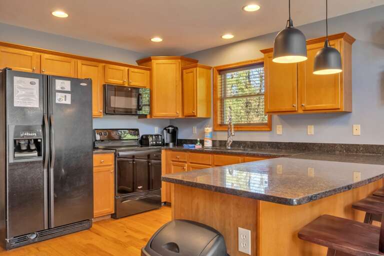 Modern Kitchen with Breakfast Bar Seating for 3.