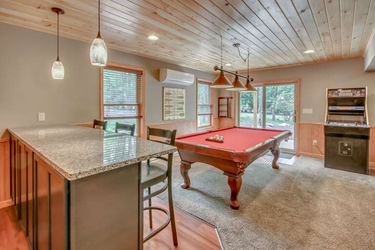 Game Room with pool table and arcade game