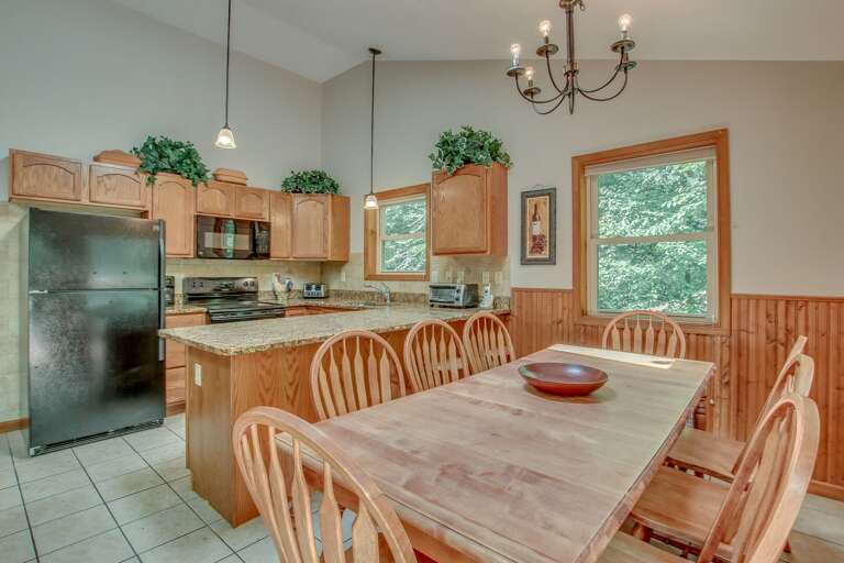 Picture of the table and chairs, refrigerator, microwave, and oven in the kitchen of this Lake Harmony rental. Picture of the table and chairs, refrigerator, microwave, and oven in the kitchen of this Lake Harmony rental.
