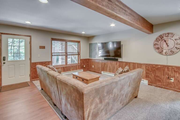 TV, Sectional Couch, and Wall Clock in our Poconos Vacation Rental Home