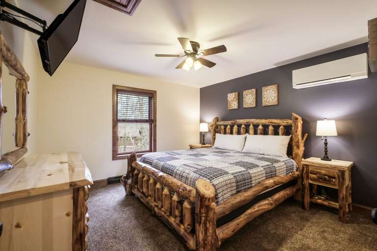 Checker Patterned Bed with Unique Artwork on Wall