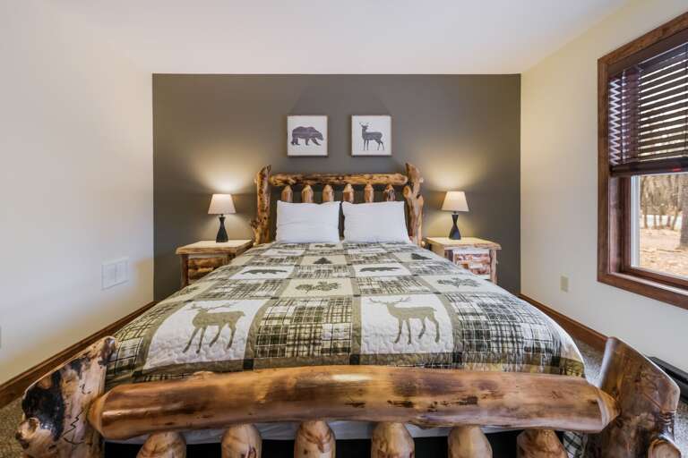 Close-Up of Bed with Deer Pattern Linens