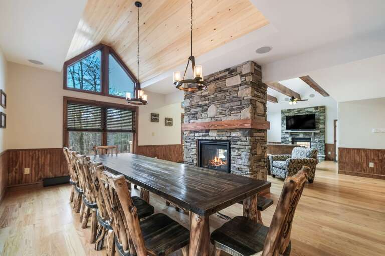 Dining Table with Chairs and Adjacent Fireplace