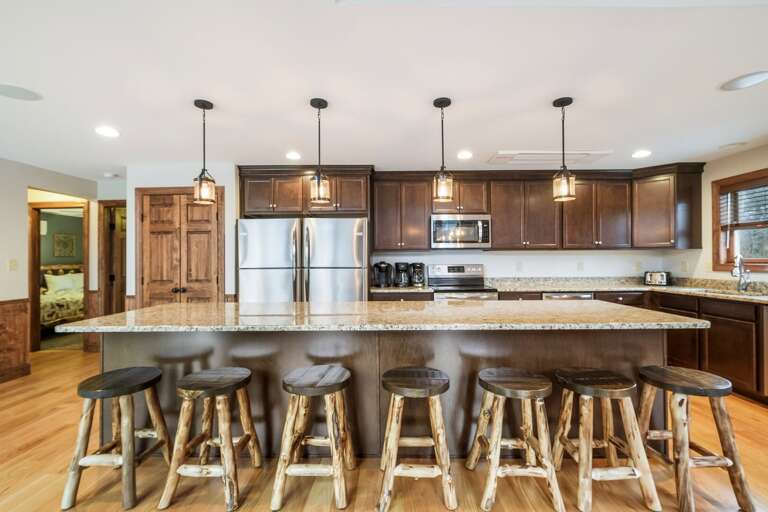 Full Kitchen with Appliances and Bar Seating