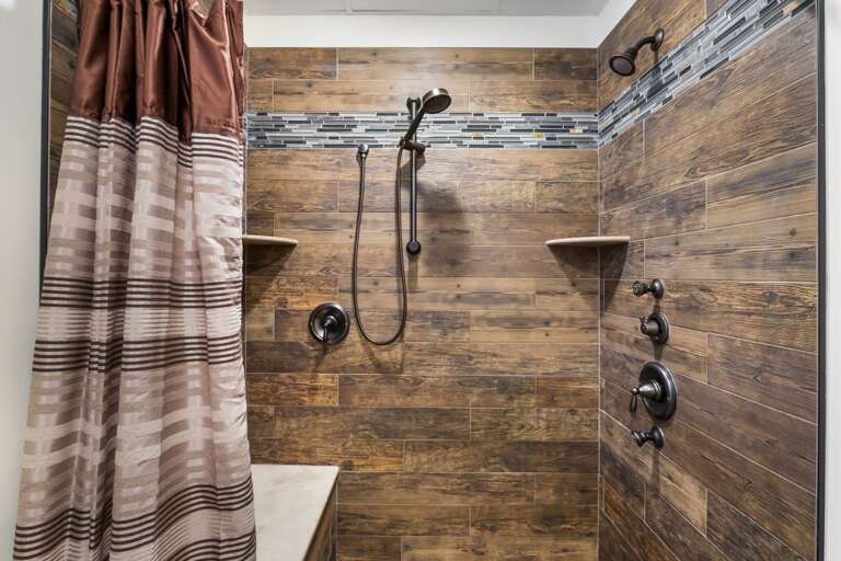 Walk-In Shower with Multiple Shower Heads and Bench