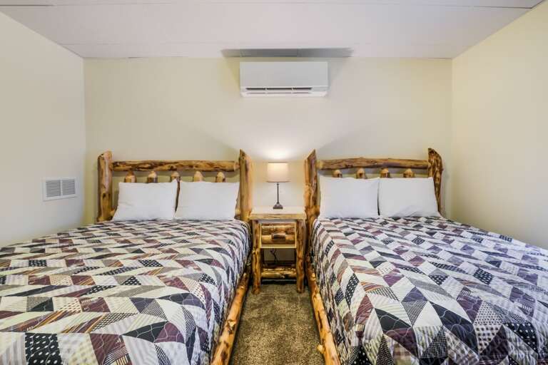 White-Walled Bedroom with Two Comfortable Beds