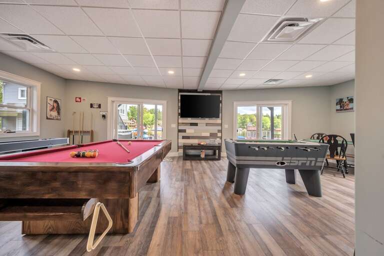 Game Room with Pool Table, Shuffleboard, Foosball, Poker Table and TV area Game Room with Pool Table, Shuffleboard, Foosball, Poker Table and TV area