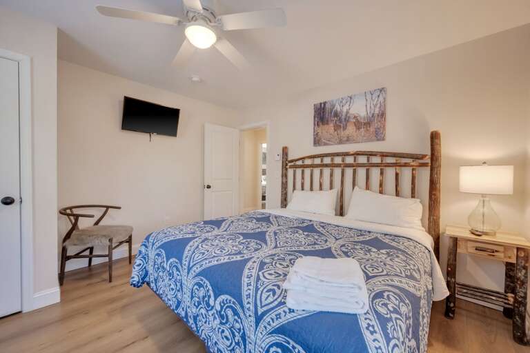 3rd Floor Bedroom 5 with 1 King Bed, Storage & TV.