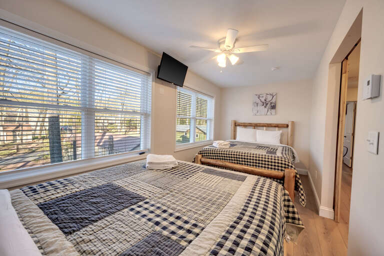 3rd Floor Bedroom 8 with 1 Queen Bed & 1 Full Bed, Storage & TV.