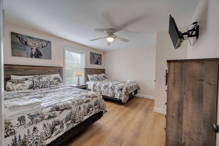 3rd Floor Bedroom 9 with 2 Queen Beds, Storage & TV.