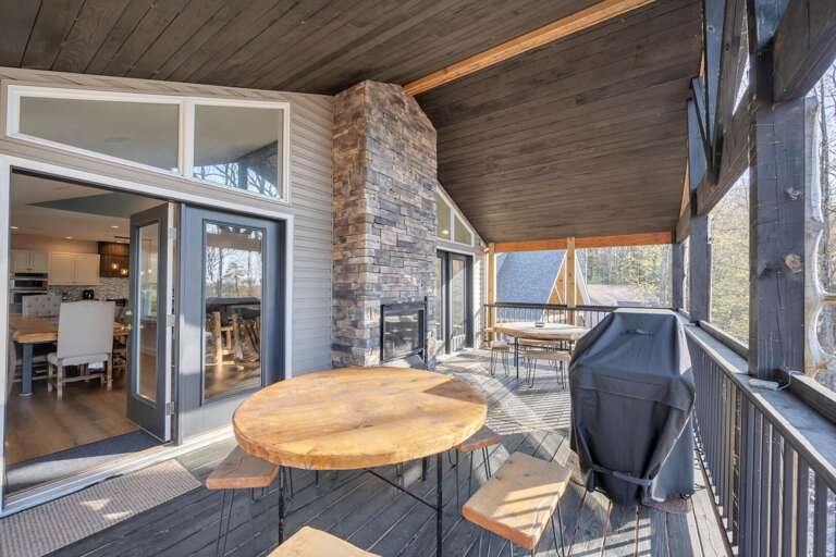 Dine Al Fresco on the 4th Floor Deck Around the Indoor/Outdoor Fireplace