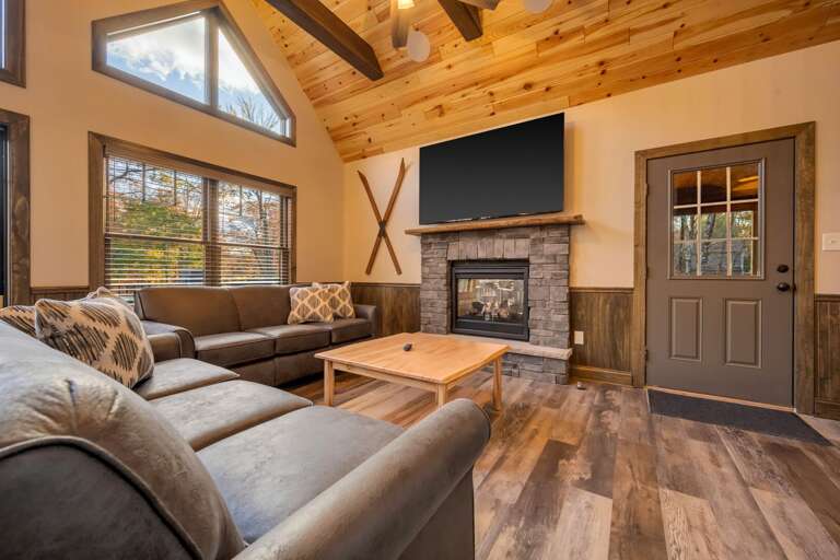 Cozy Up on the Sofa in the Mountain Chalet Inspired Great Room with Smart TV and Indoor/Outdoor Fireplace. Cozy Up on the Sofa in the Mountain Chalet Inspired Great Room with Smart TV and Indoor/Outdoor Fireplace.
