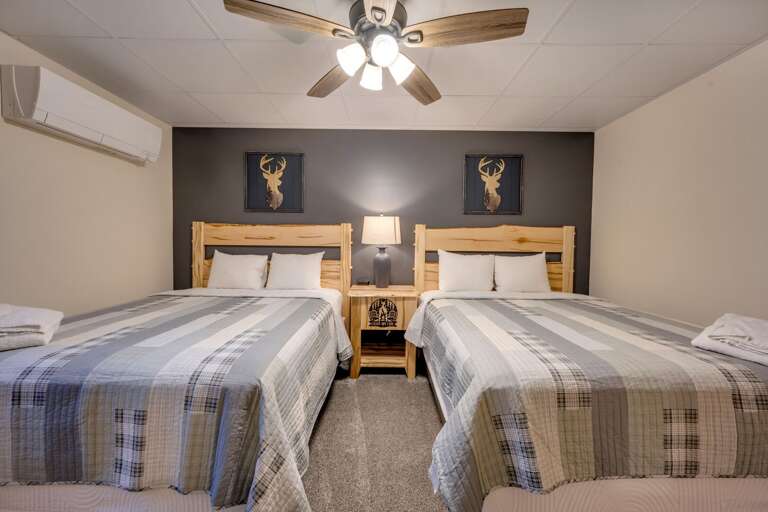 Napping is Essential in the 1st Floor Bedroom 2 with 2 Queen Beds (sleeps 4). Napping is Essential in the 1st Floor Bedroom 2 with 2 Queen Beds (sleeps 4).