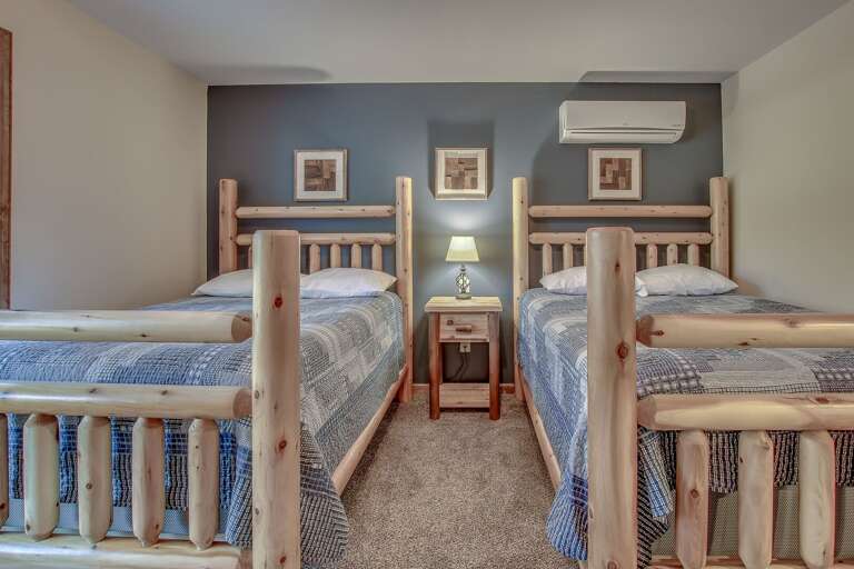 Alternate View of Bedroom with Two Beds and Artwork