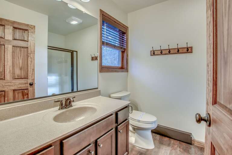 Cozy Bathroom with Sink, Toilet and Exterior Window