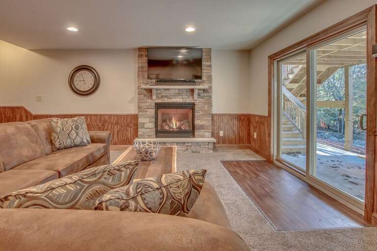 Sofa, Fireplace and TV with View of Porch