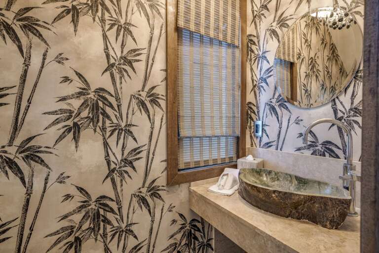 Half bathroom located left of entry door. Half bathroom located left of entry door.