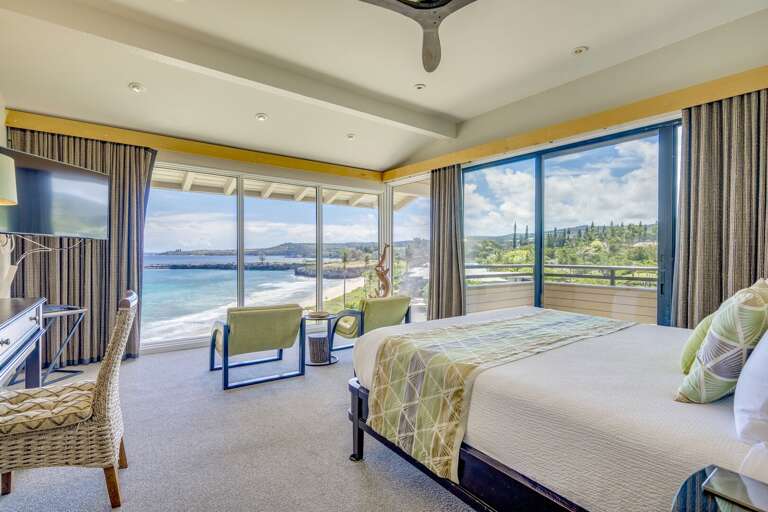 Ceiling to wall windows in this oceanfront bedroom. Ceiling to wall windows in this oceanfront bedroom.